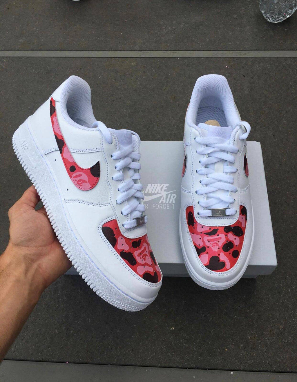 Hypebeast streetwear brand Bape sneaker customs, hand painted pink camo design with bape ape on nike air force 1 white